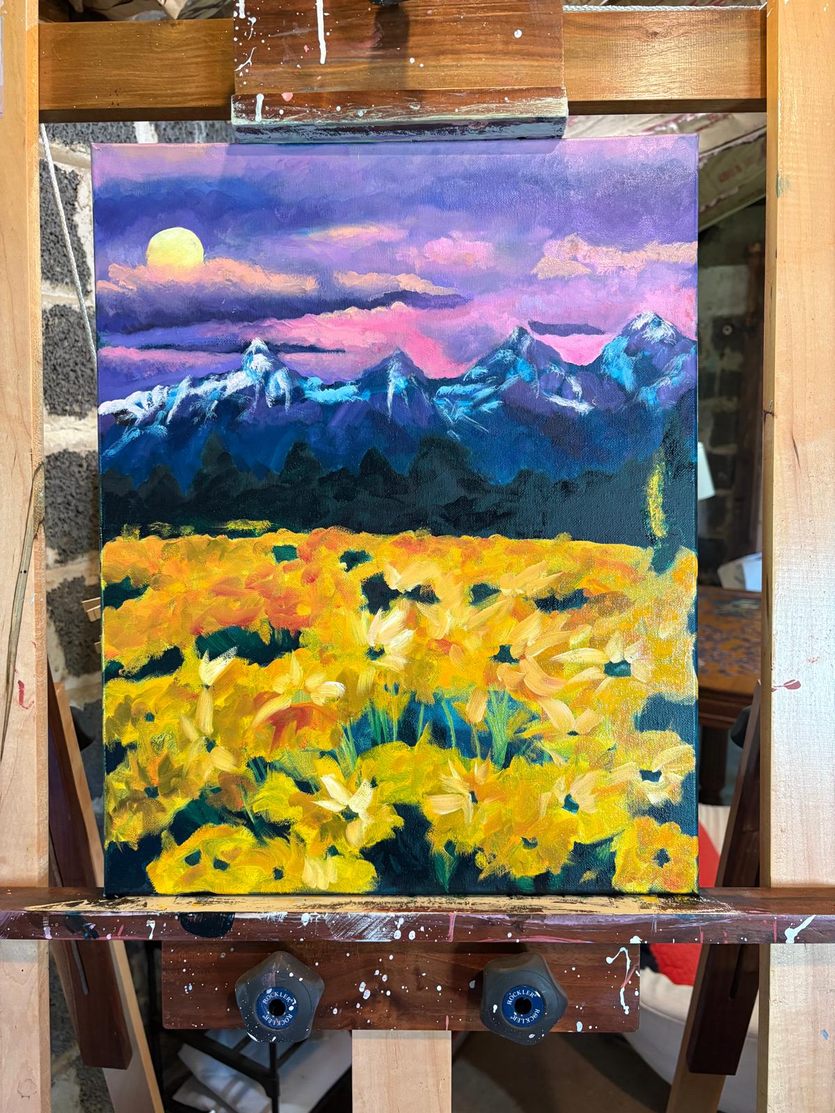 Sunflowers beneath a mountain moon